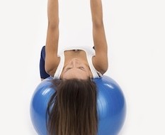 woman excercising using ball